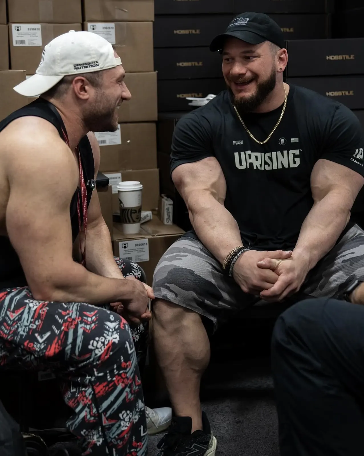 David DeMesquita talking with an athlete backstage